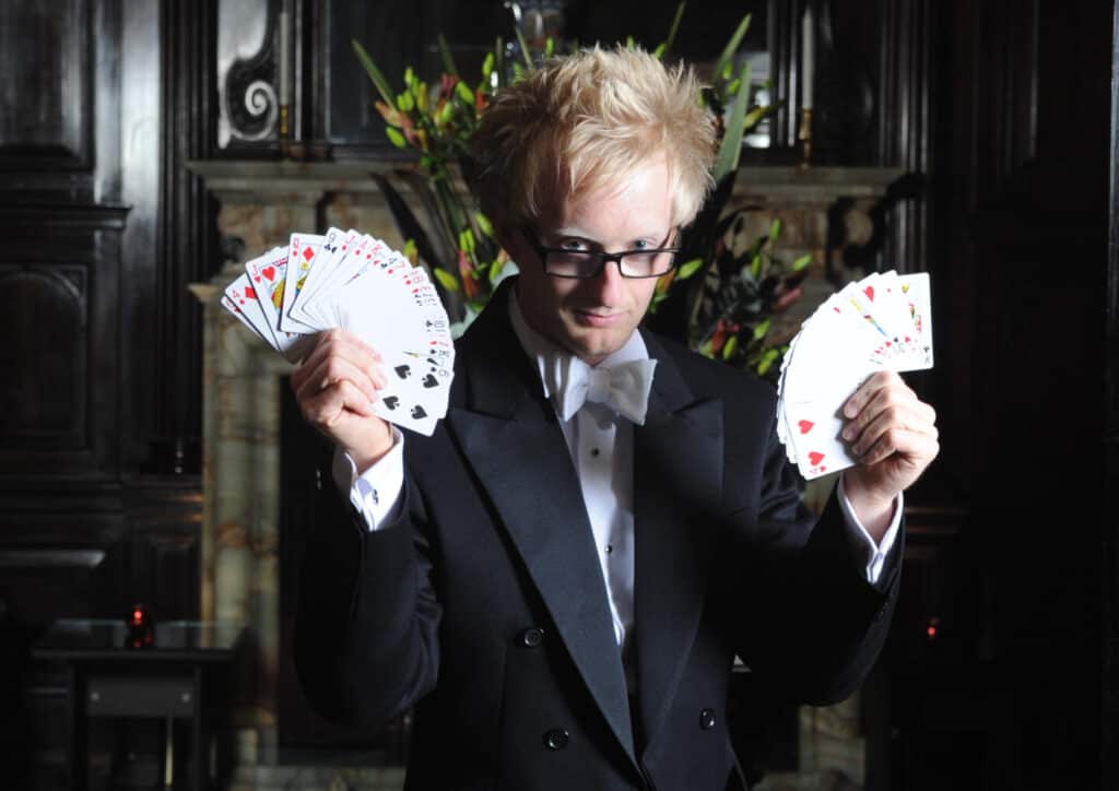 Magician Tony Middleton holding fans of playing cards