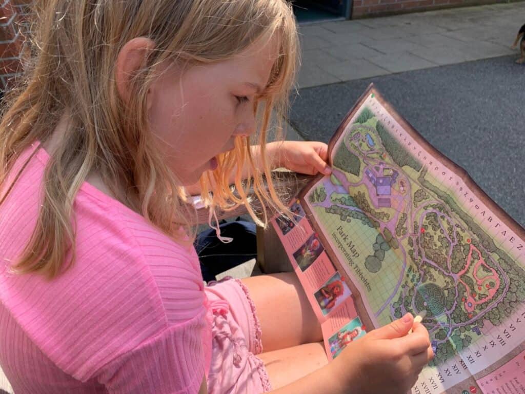 Tot looking at map of Hidden Valley Discovery Park