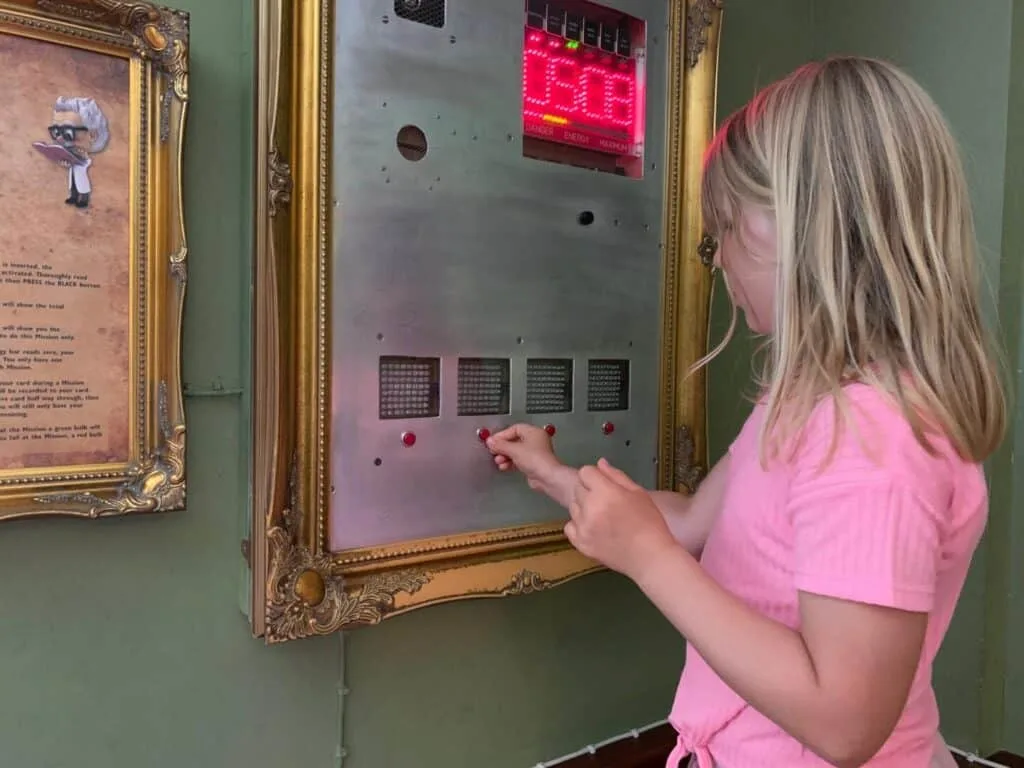 Tot playing mission board in Forbidden Mansion