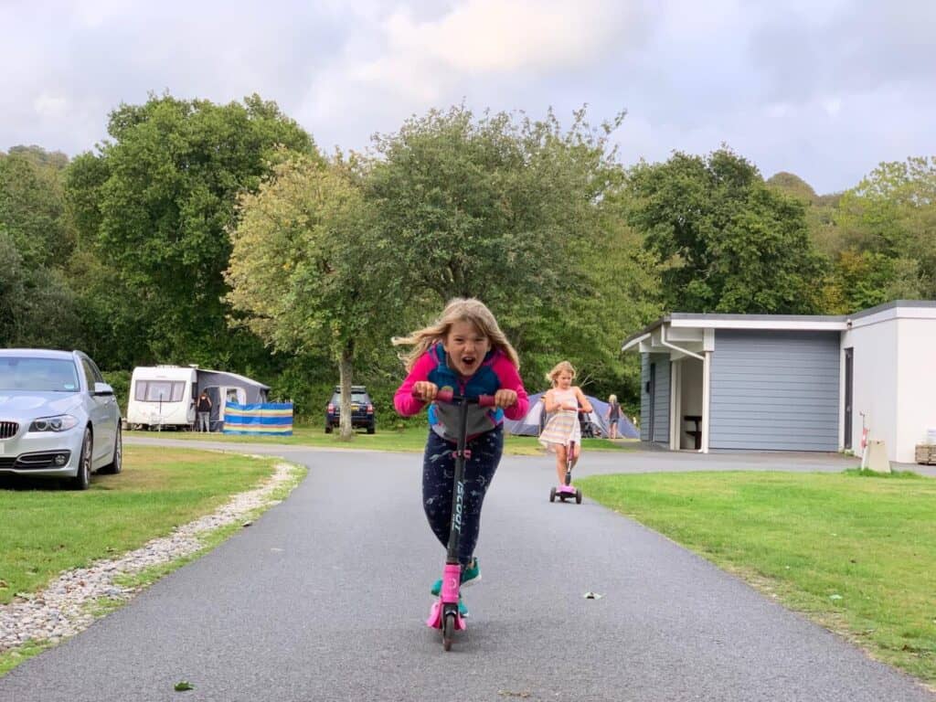 Kids scooting at Little Winnick campsite