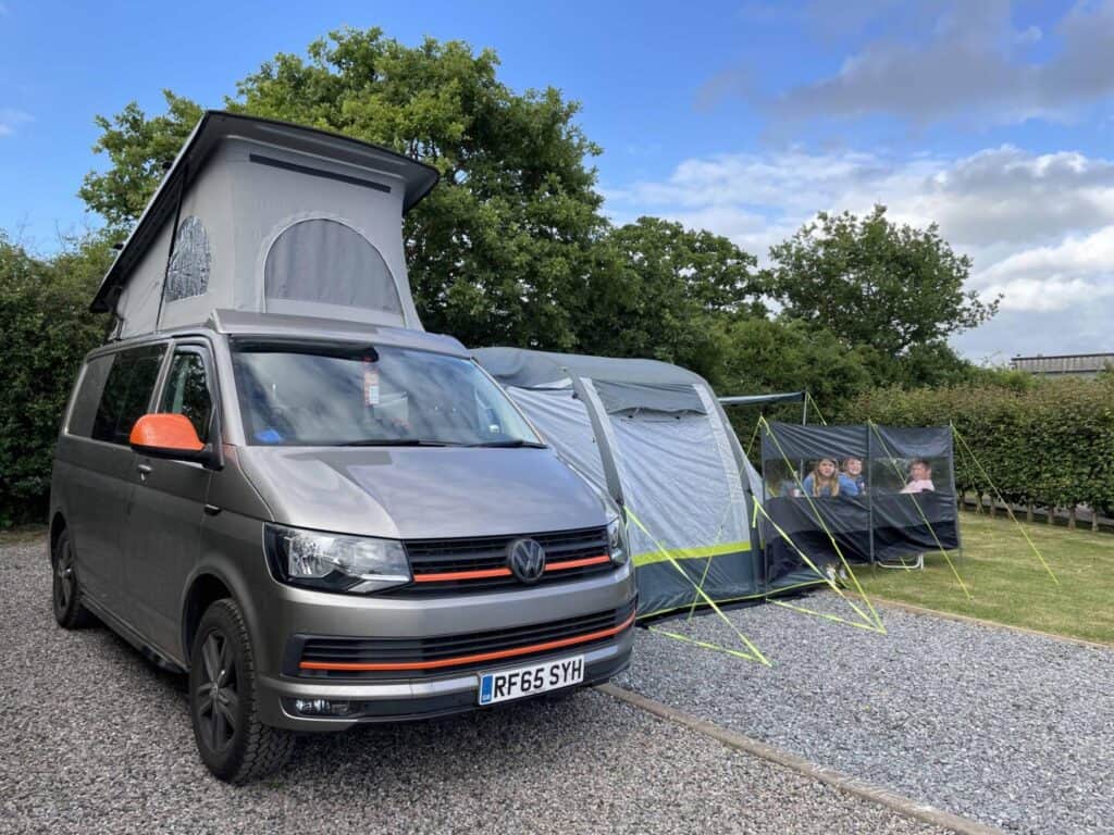 VW T6  camper van and awning on campsite pitch