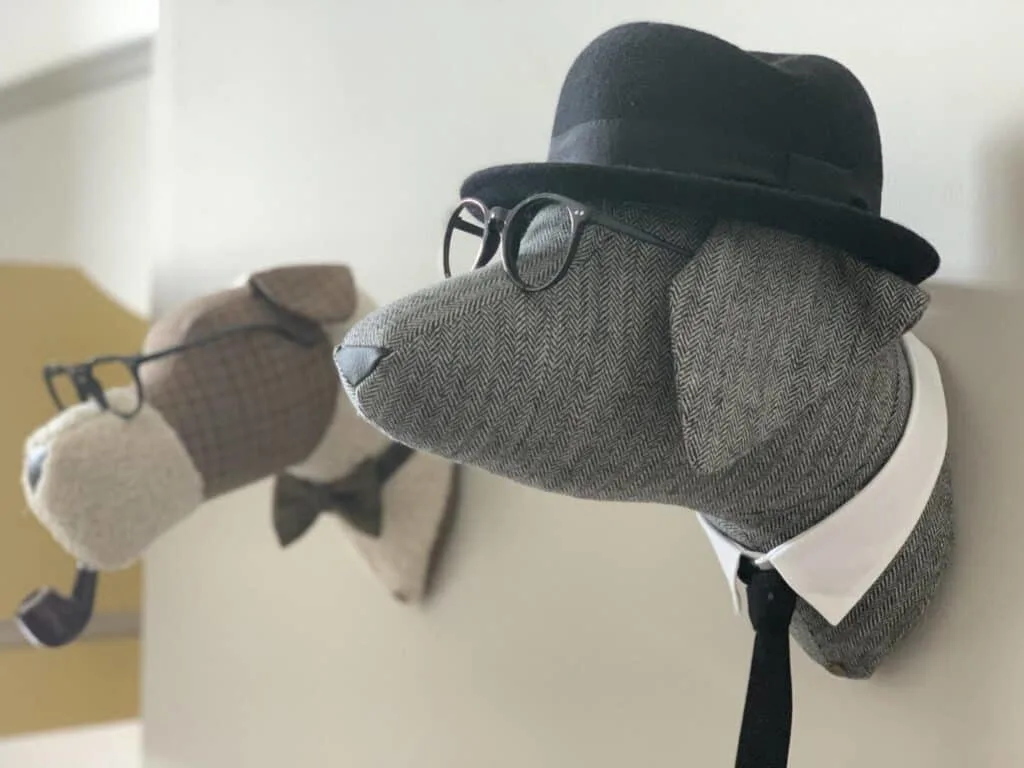 Dog busts on hotel room wall