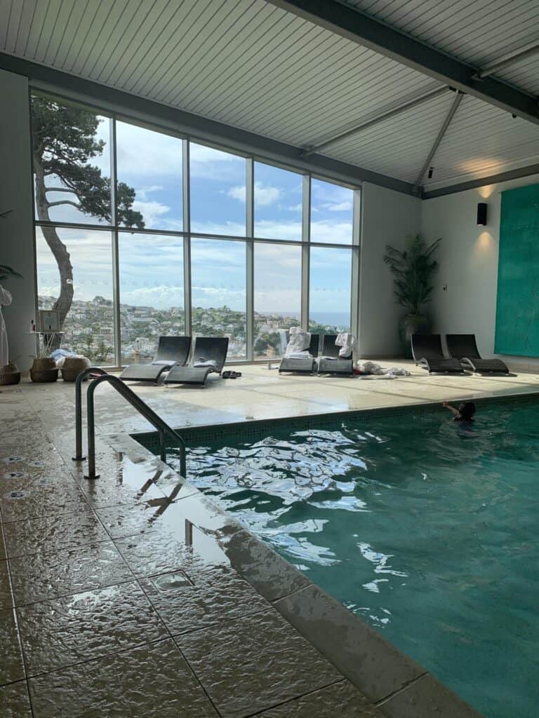 The indoor swimming pool at Fowey Hall Hotel overlooking a view of Fowey