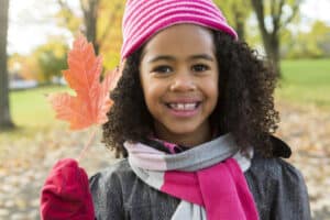 Girl holding a autumn leaf