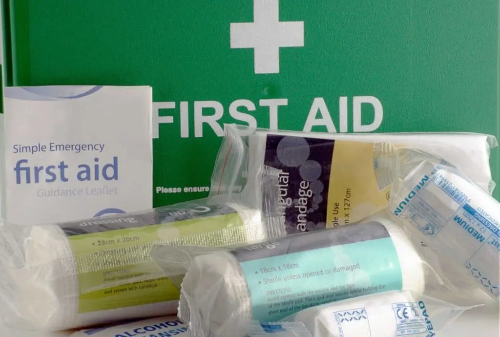 Green first aid box and contents