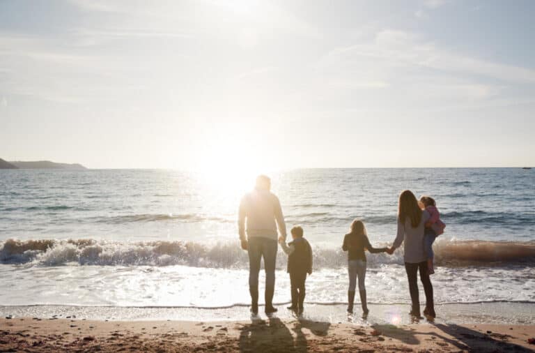 Family on beach in winter