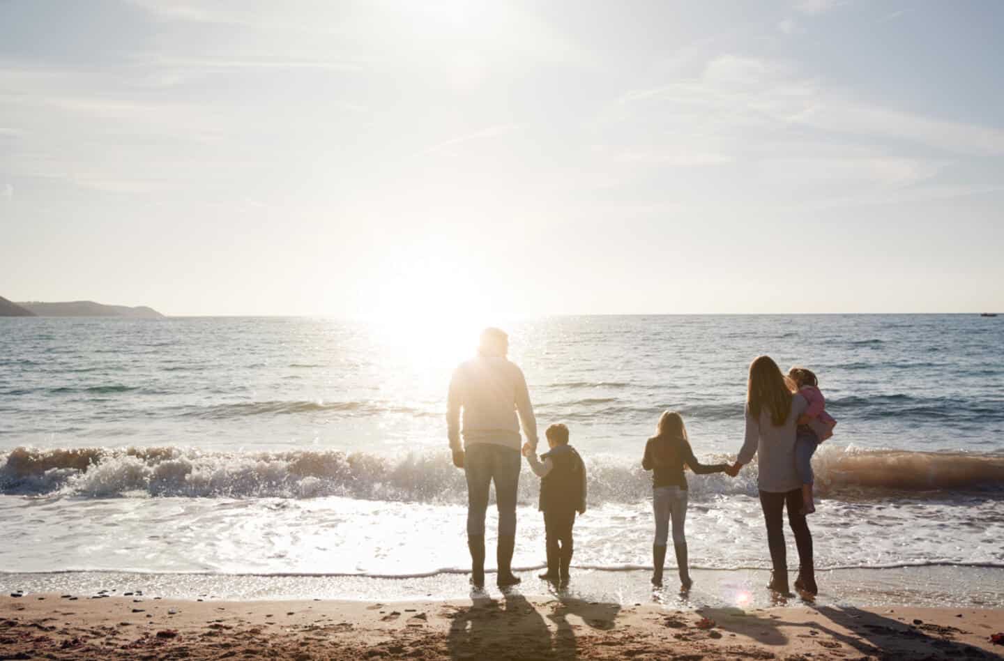 Family on beach in winter