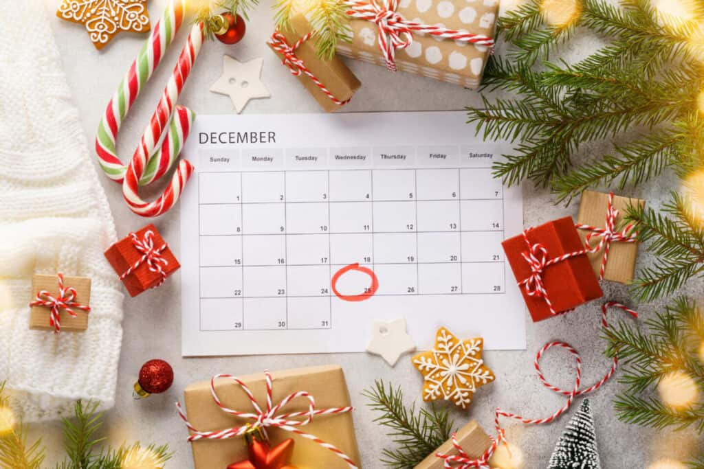 December calendar surrounded by Christmas decorations