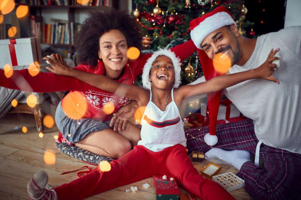 Happy family have fun together at Christmas morning