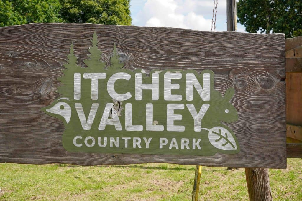 Sign for Itchen Valley Country Park. woodland park with sport and leisure activities