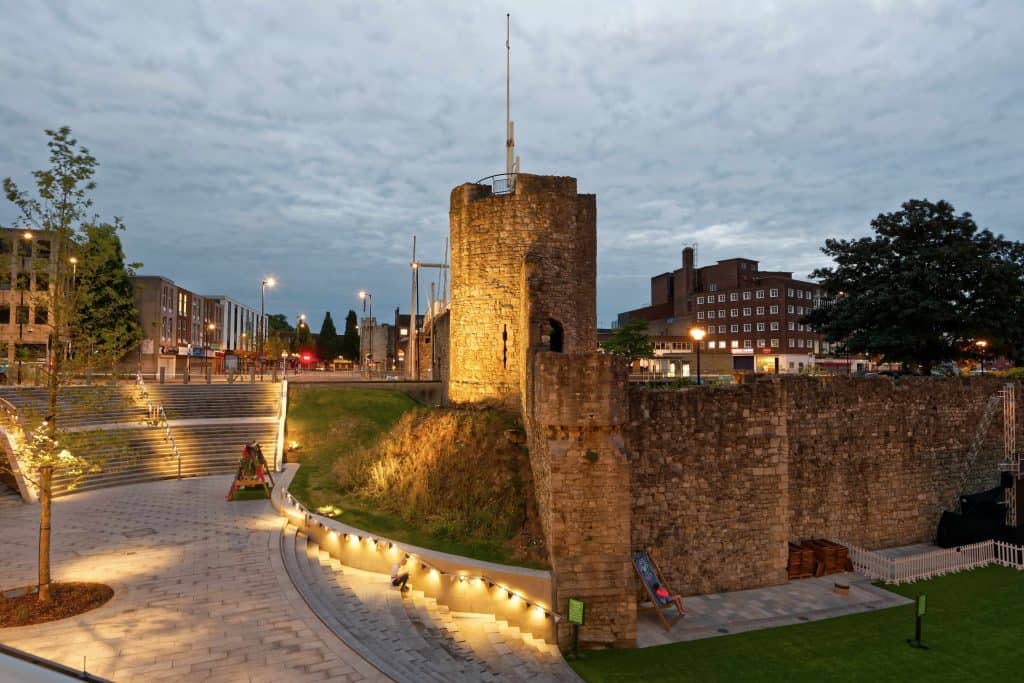 Southampton city walls lit up at dusk