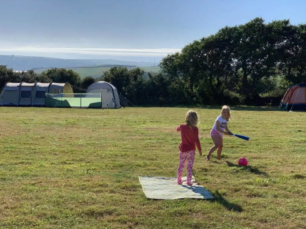 Kids playing a ball game on campsite