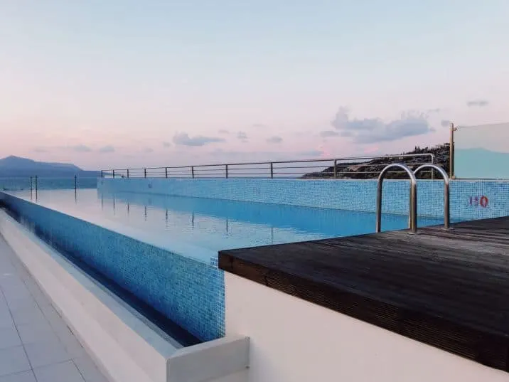 Infinity pool at sunset at Almyrida Residence hotel