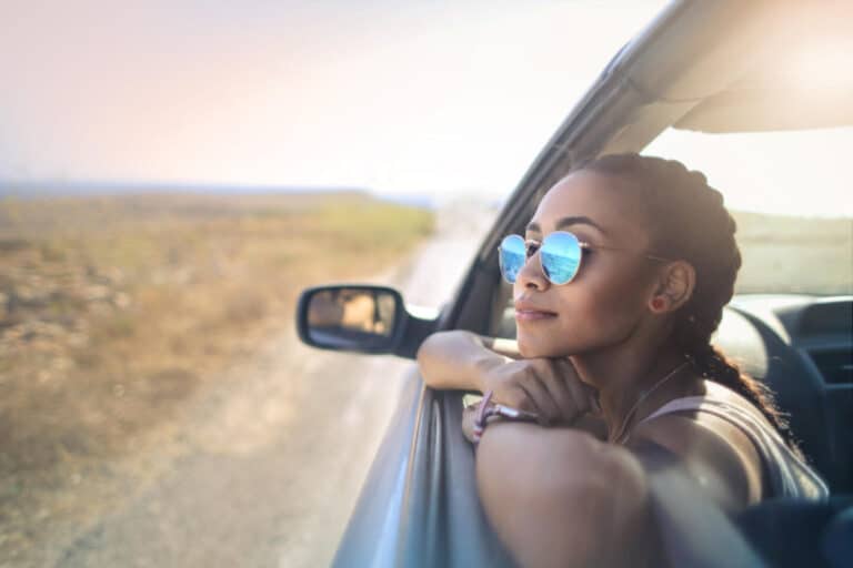 Woman looking out of car window