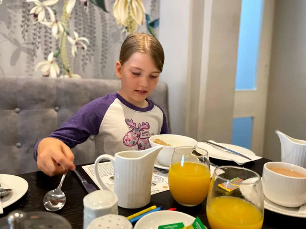 Tot at breakfast table at hotel