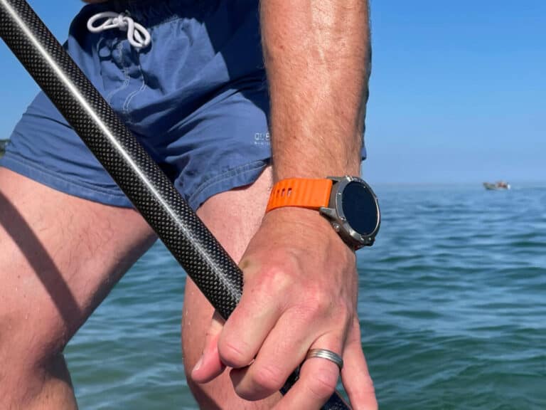 Garmin Fenix 6 Sapphire on wrist of paddle boarder