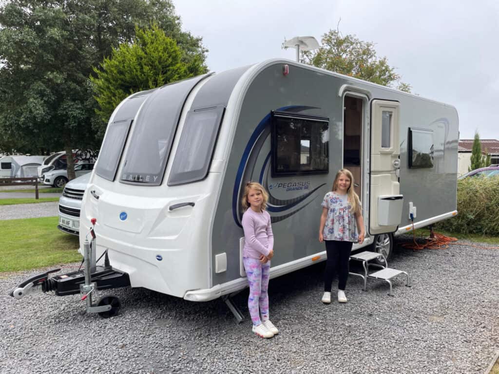 Children stood outside caravan