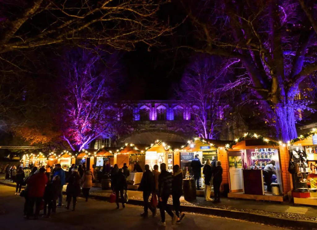 Visitors experience Winchester Cathedral's Christmas Market and Evensong takes places in the nave.