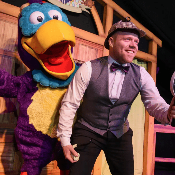 Mr Cadbury's Parrot and actor on stage