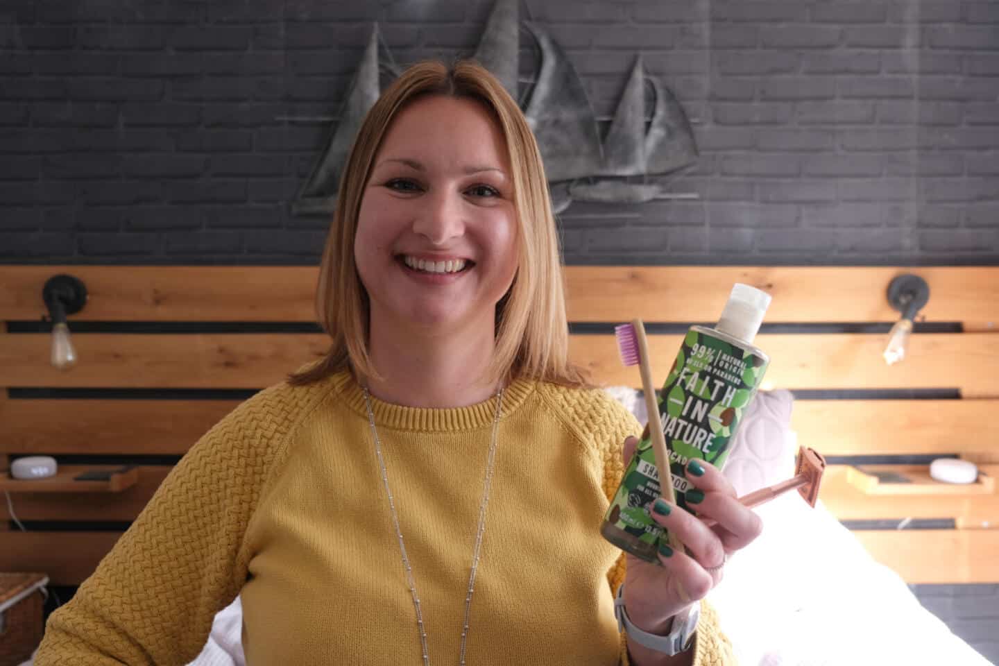 Claire holding eco friendly toiletries