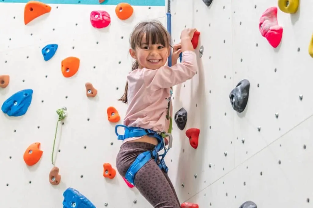 Child on climbing wall at Seals Cove