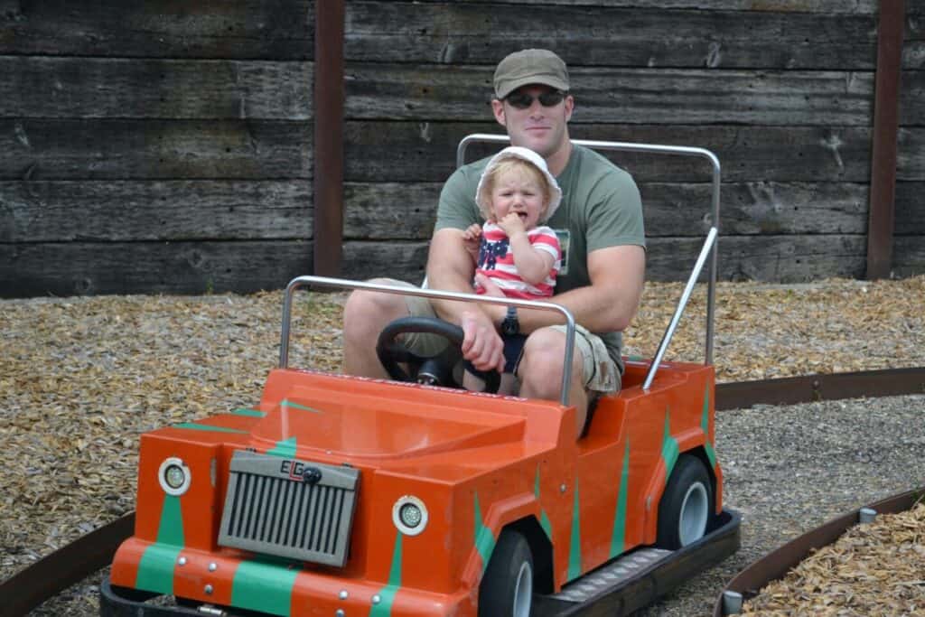 Family in electric mini car at Longdown Activity Farm