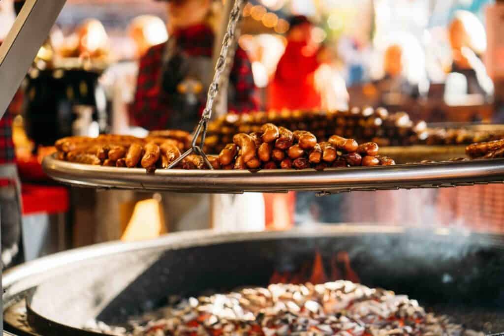 Traditional Delicious German grilled sausages at Christmas market