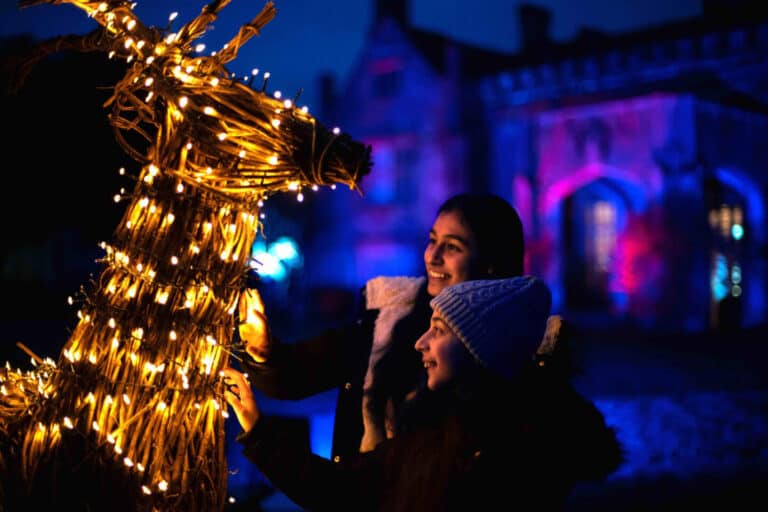 Family enjoying the Glow illuminated trail at Marwell Zoo in Hampshire