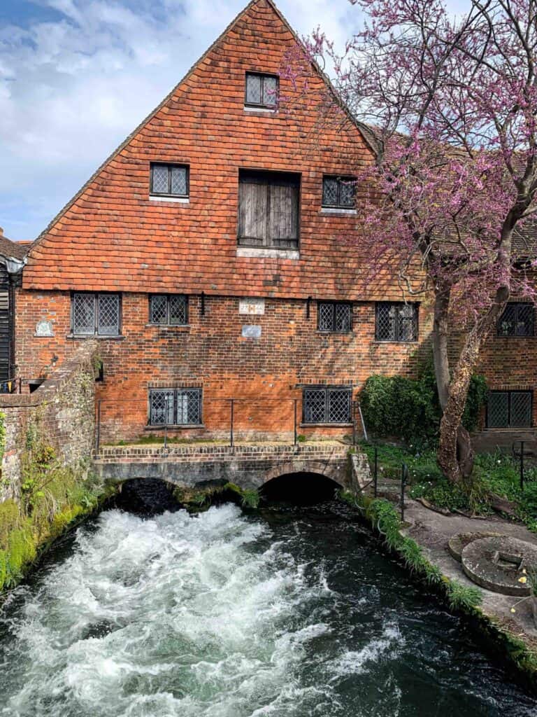 Winchester city mill view Hampshire England medieval architecture Bridge over Itchen river. UK