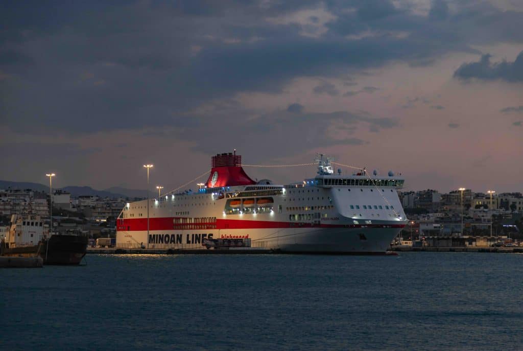 A picture of a Minoan Lines ferry at the Heraklion Port, at sunset.