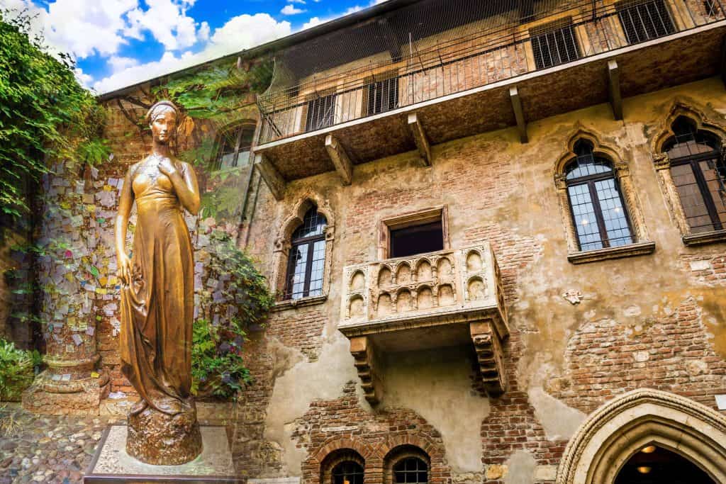Bronze statue of Juliet and a balcony in Verona Italy