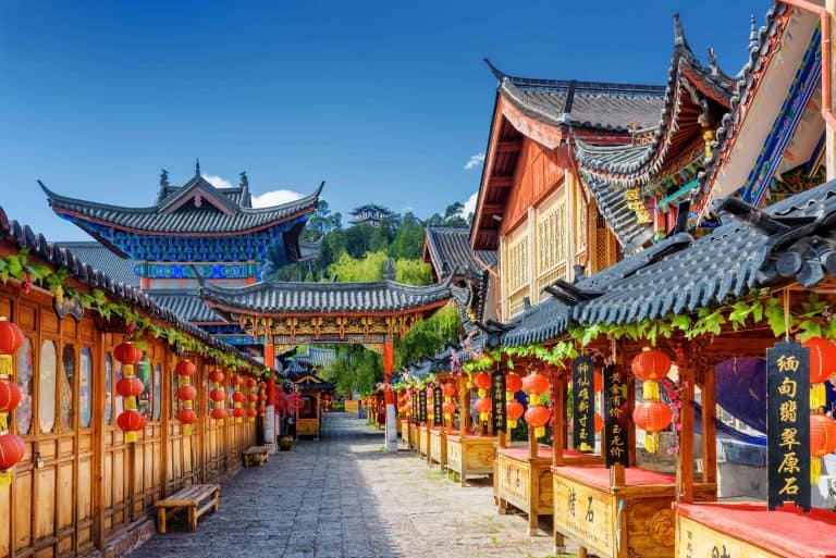 Ancient street decorated with traditional Chinese red lanterns in the Old Town of Lijiang. Lijiang is a popular tourist destination of Asia.