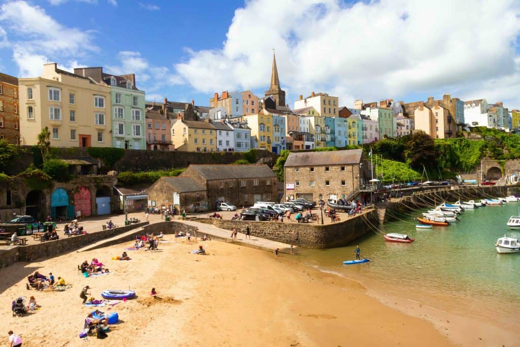 Picturesque Tenby Harbour captured at low tide. A lovely sunny day highlighting the colourful houses.