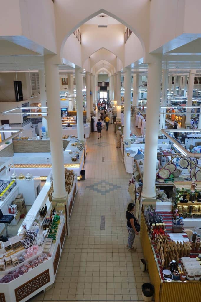 A balcony view of the inside of Nizwa food souk where there are lots of open food and produce shops