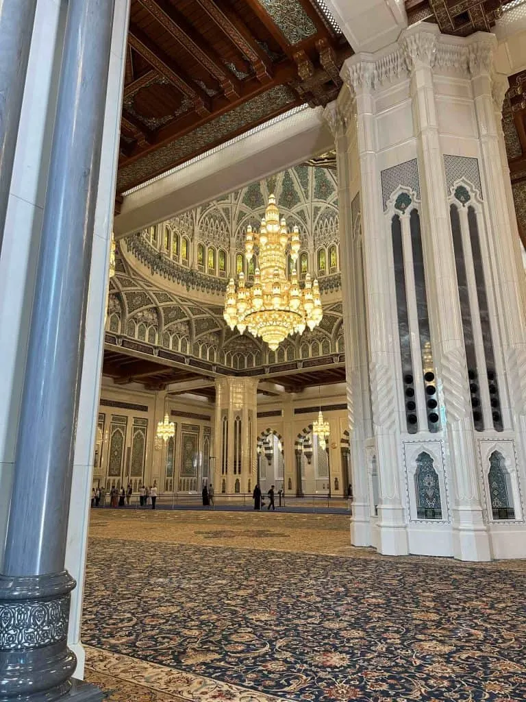 Elaborately decorated colours and huge chandelier of the Main Prayer Room inside Oman's Grand Mosque