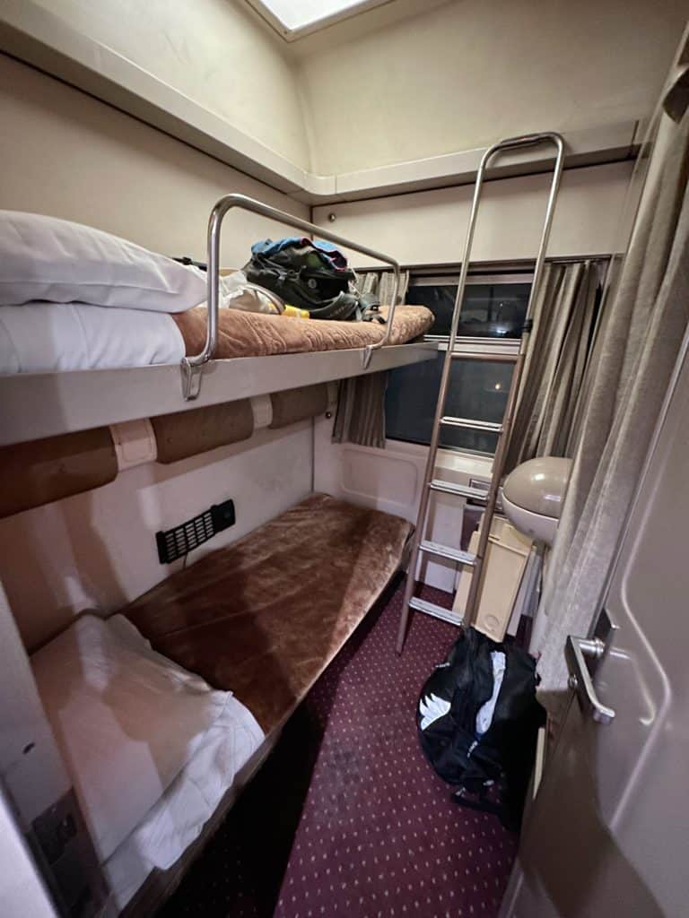 Our cabin on the Cairo to Aswan sleeper train. There are bunk beds and a ladder