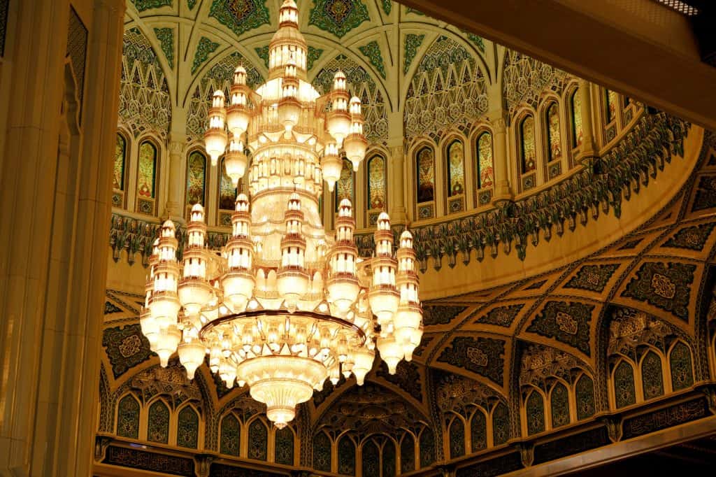 The two storey high chandelier made of Chrystal hanging in an elaborately decorated dome