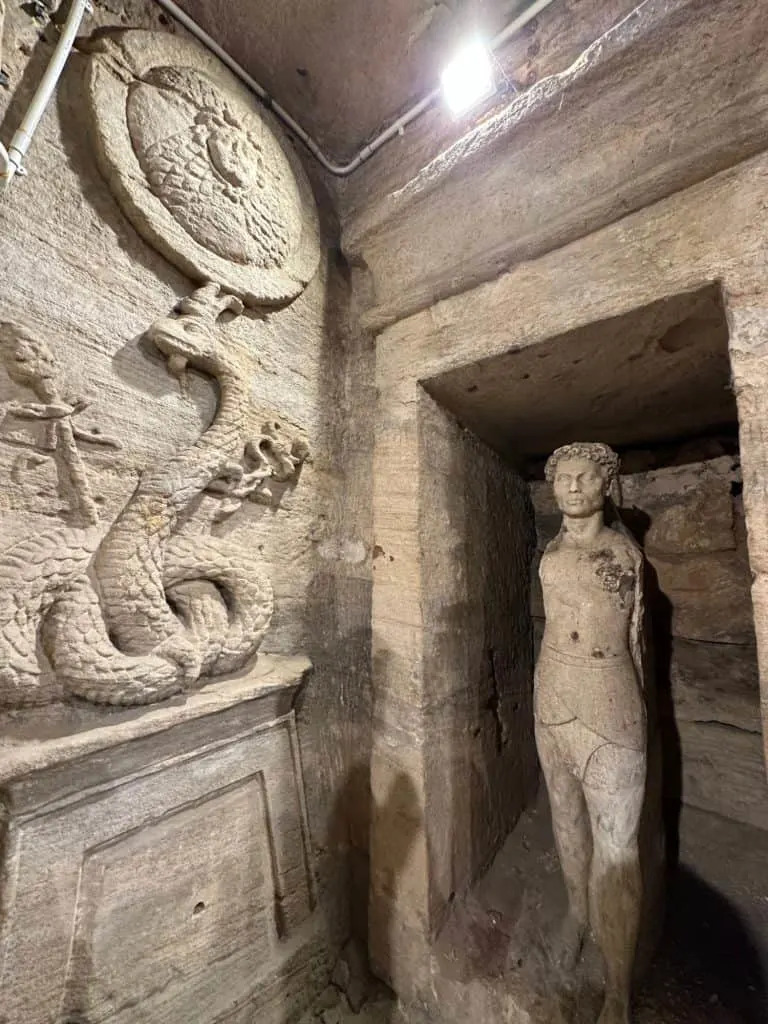 Graeco-Roman styles statues carved into sandstone in catacombs