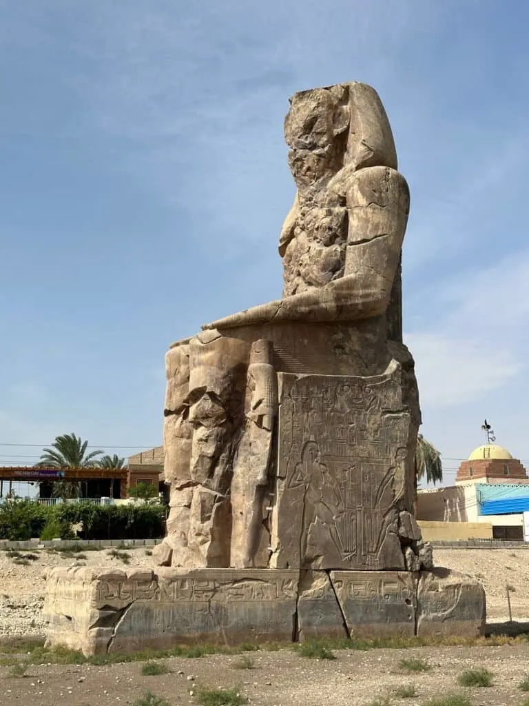 Giant sandstone statue - one of two called the Colossi of Memnon