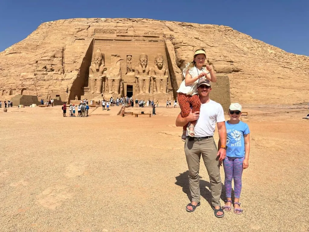 Mr Tin Box with his daughters outside Rameses II's temple at Abu Simbel