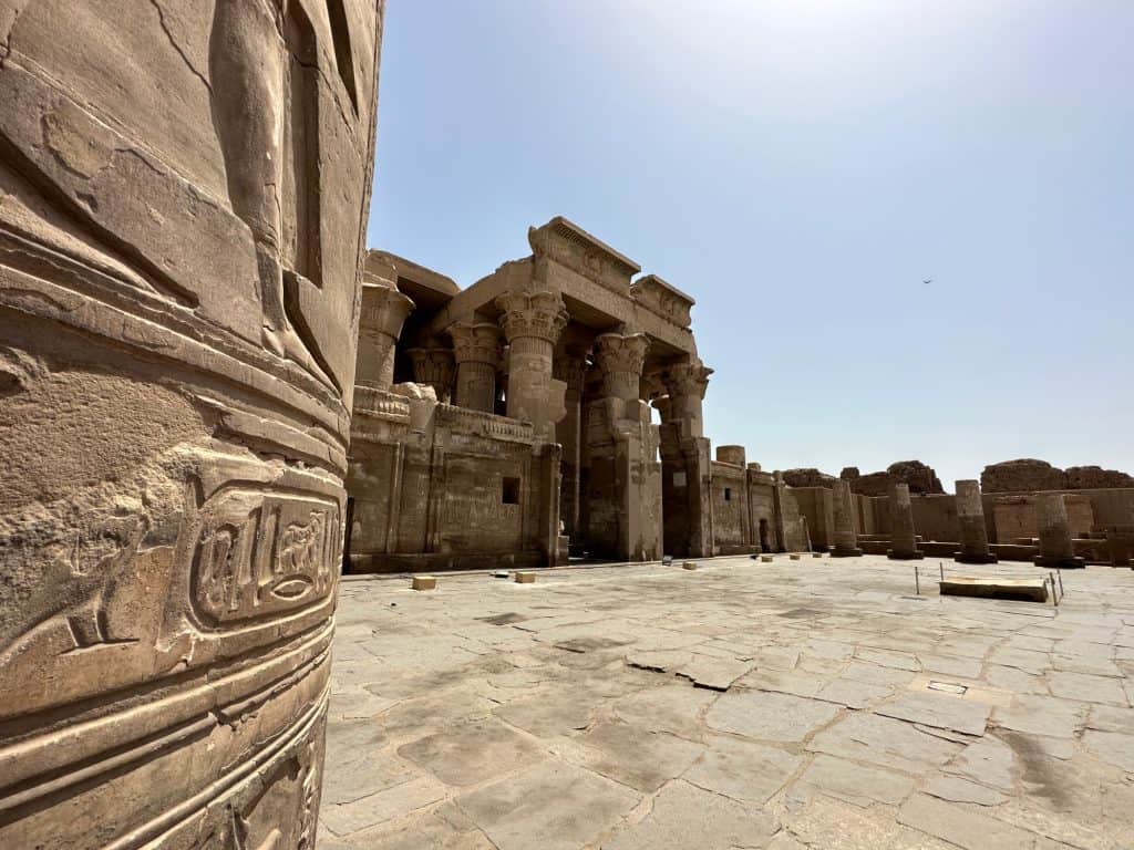 The front of Kom Ombo temple with a decorated column in the foreground