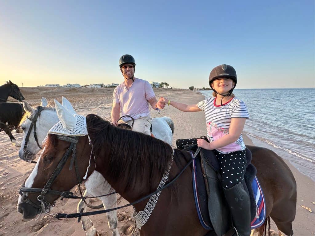 Mr Tin Box and daughter riding horses on the beach at Hurghada on the Red Sea. It is sunset