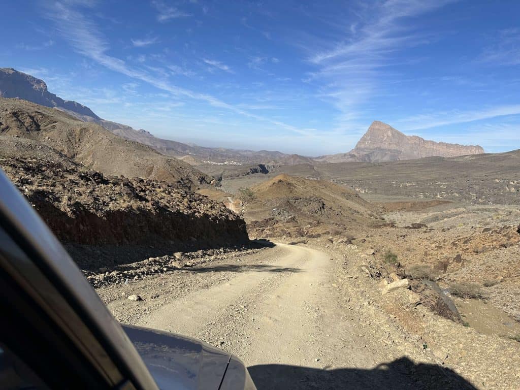A photo taken out the window of out car of the mountain road down towards Wadi Damm in the Hajar Mountains