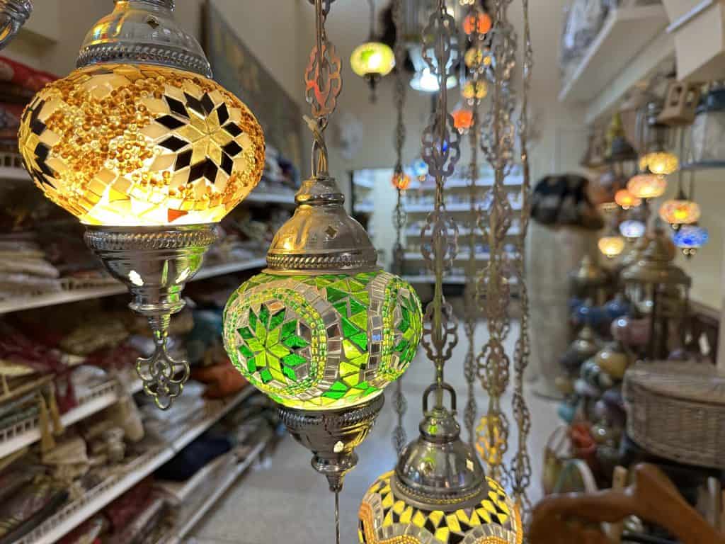 Colourful metal and glass mosaic Arabic lanterns hanging in the souq at Nizwa