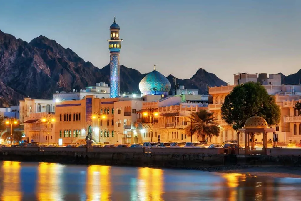 Night time view of Muttrah Corniche, Muscat. Lights sparkle on the harbour