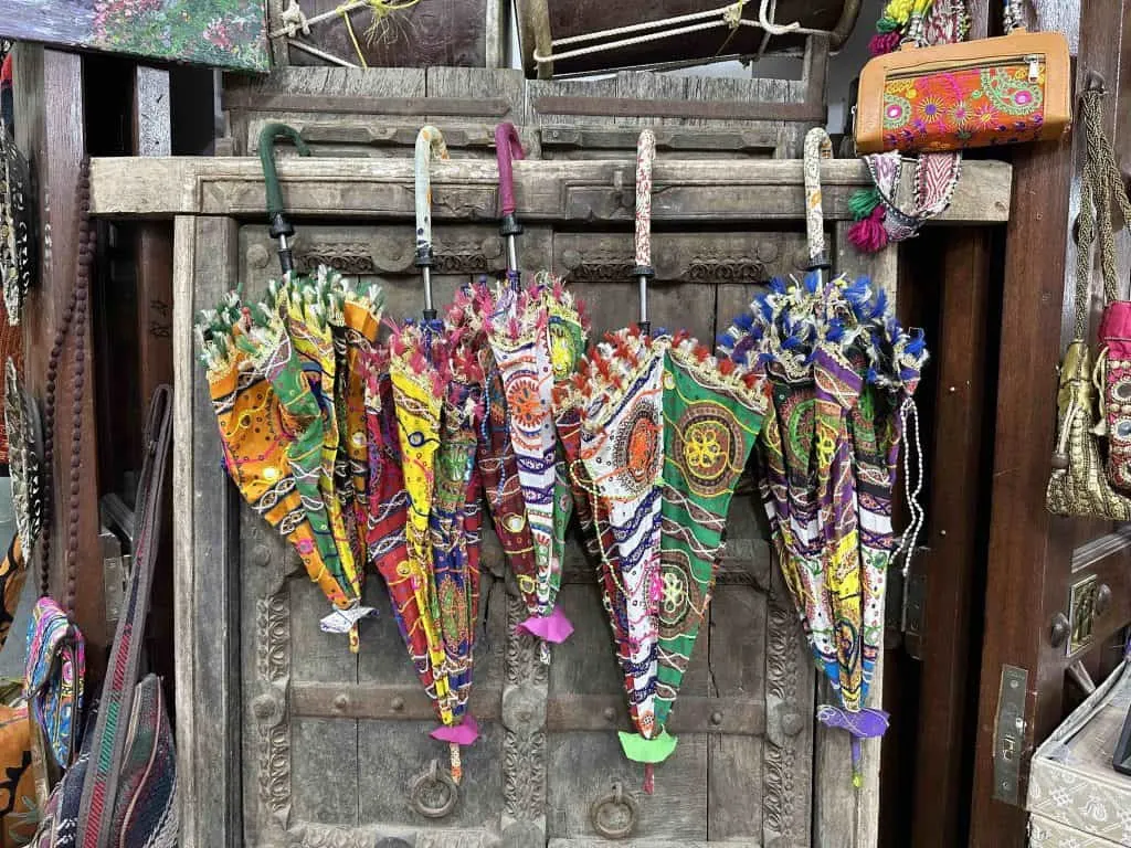 Colourful umbrellas hanging own a rail in Nizwa Souq