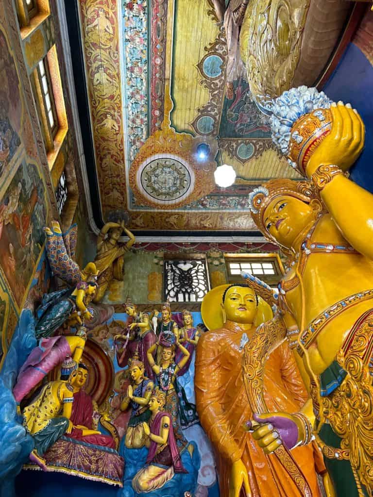 Colourful Buddhas inside Gandaramaya Temple