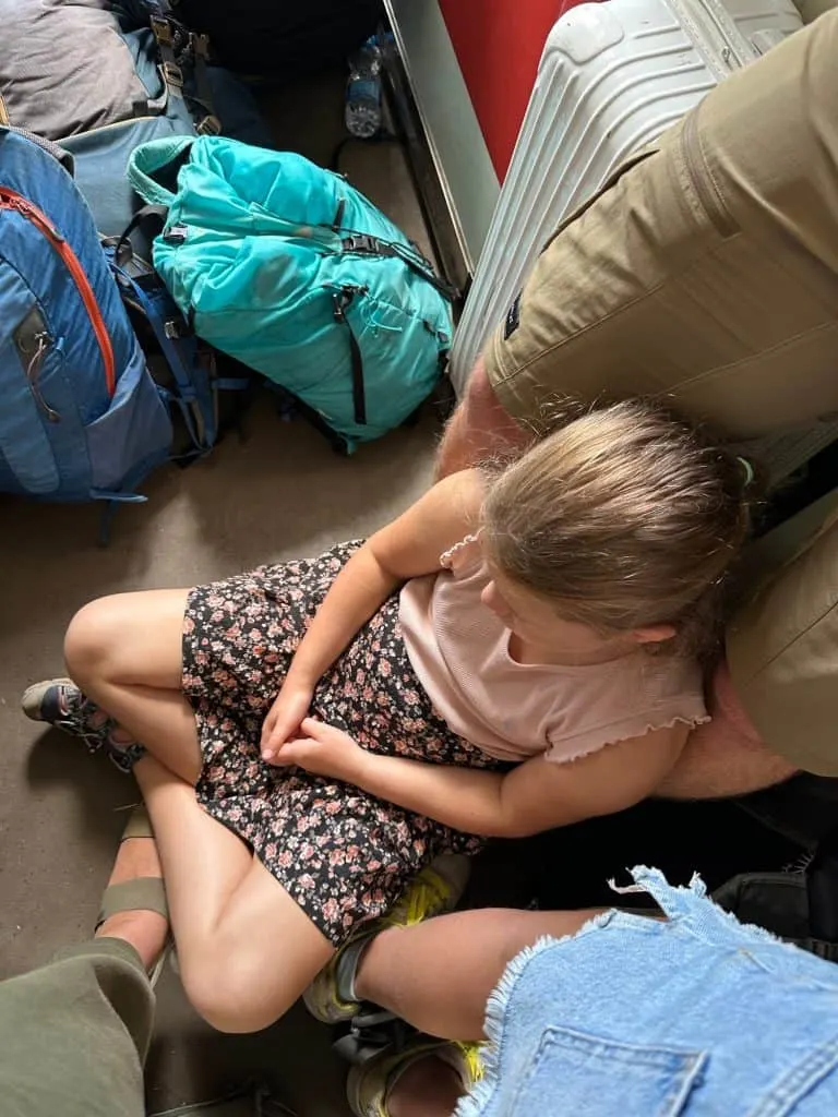 Our eight year old sat on the floor of a train carriage