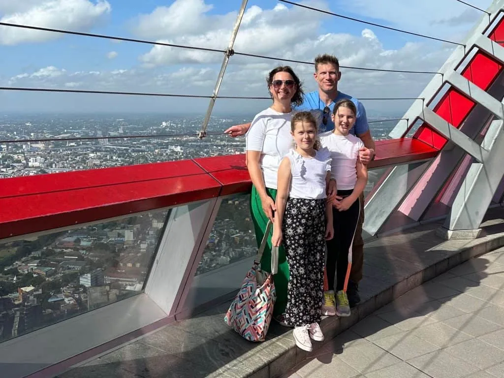 Tin Box family on pose on the viewing platform of the Lotus Tower with views of Colombo city in the background