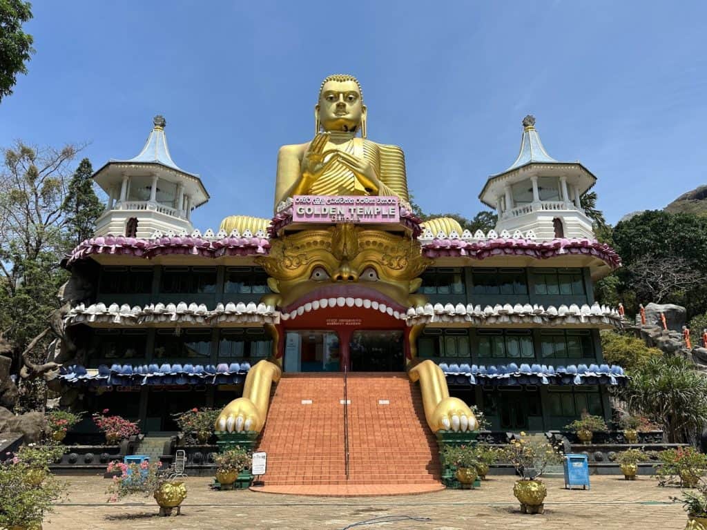 Golden Buddha appears to be sat on top of the Buddhist Temple at Dambulla